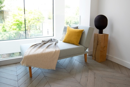 Snooze Sofa Bed (Grey) - with pillows and a  throw